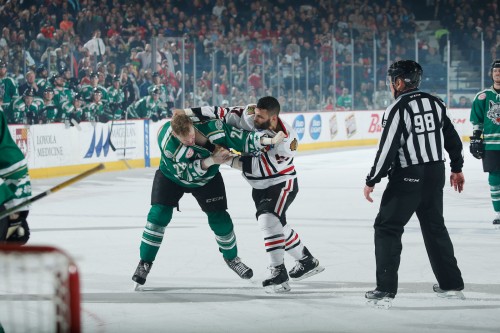 These two. Jacob Doty and Mike Liambas get reacquainted during Friday’s Illinois Lottery matchup at Allstate when they drop the gloves. Again. Photo: Ross Dettman/Chicago Wolves